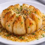 air fryer onion boil served on plate juicy buttery caramelized onion petals