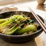 Korean bok choy recipes with sesame seeds garlic and gochugaru on white marble