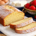 Moist Stock’s pound cake sliced with powdered sugar and strawberries