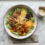bob evans wildfire salad recipe with grilled chicken corn black beans and bbq ranch dressing on white marble