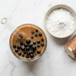 : does boba have gelatin bubble tea with tapioca pearls on white marble