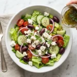 pioneer woman greek island dressing recipe in mason jar on white marble with ingredients