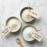 Agar-agar, pectin and arrowroot powder in small bowls on marble