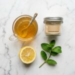 sugar free gelatin recipe for weight loss with herbal tea and lemon on white marble