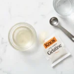 what is gelatine made of — knox gelatin powder and dissolved gelatin on white marble