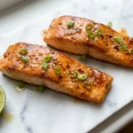 Hot honey glazed salmon fillets with chili flakes and sesame seeds