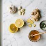 arterial flush recipe ingredients garlic lemon and ginger on white marble