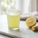 arterial flush recipe tonic served in glass with lemon and ginger garnish